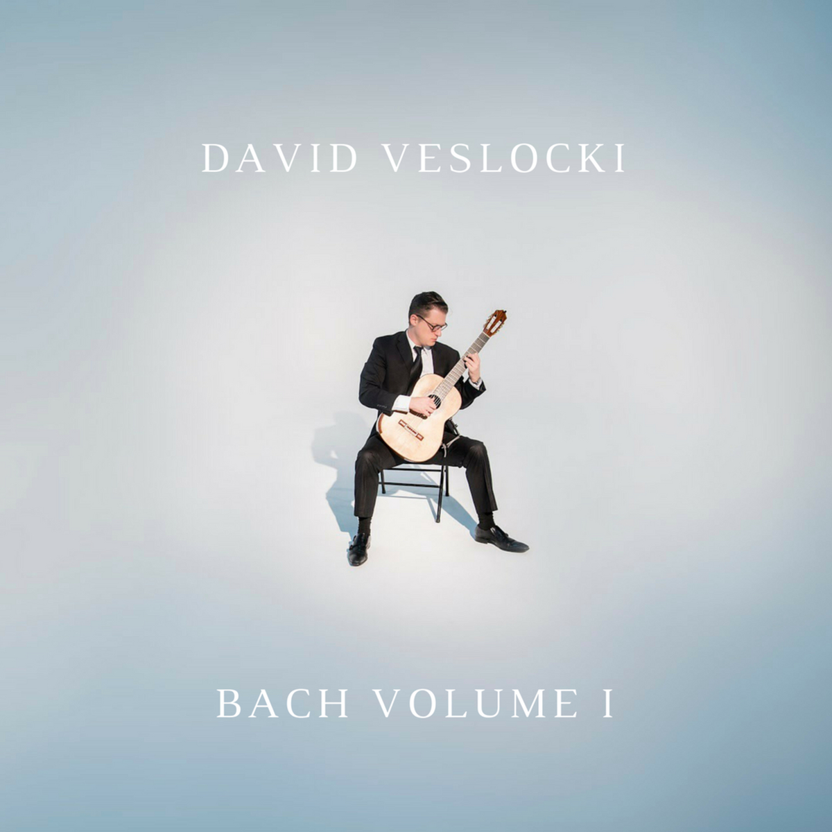 Cover art for David Veslocki – Bach Volume I, showing the artist performing on classical guitar